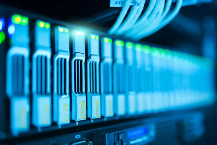 Blue-lit data center server racks